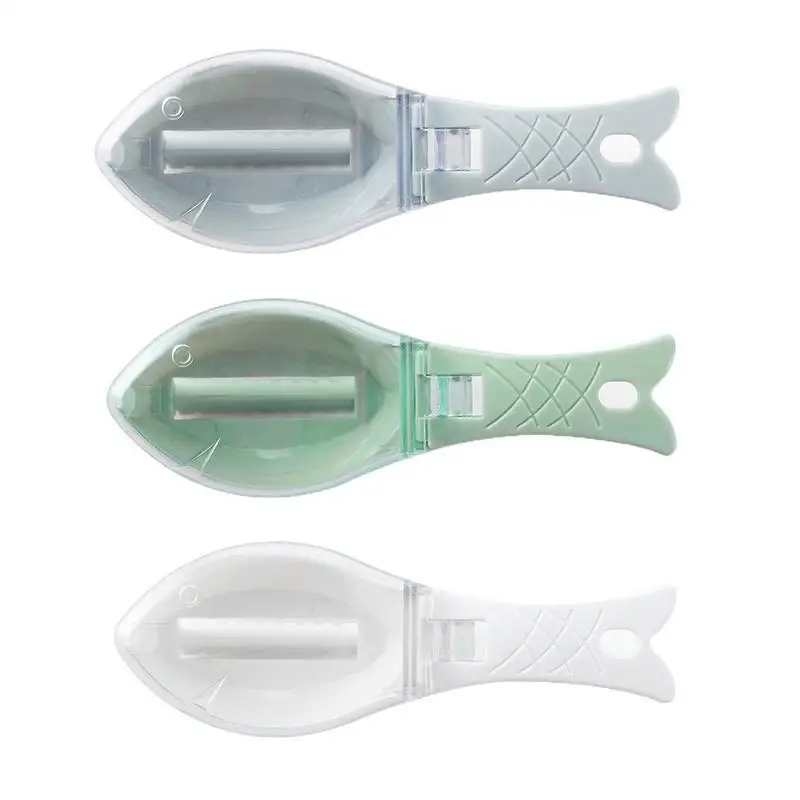 Transparent cover fish-shaped scraping scales Plastic cover container cleaning easy handle with hanging holes serrated blades 
Transparent cover fish-shaped scraping scales Plastic cover container cleaning easy handle with hanging holes serrated blades
