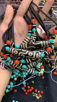 Tibetan rough old dzi agate with matching turquoise red glaze handmade necklace with fine workmanship and smooth bone lubricatio
Tibetan rough old dzi agate with matching turquoise red glaze handmade necklace with fine workmanship and smooth bone lubricatio