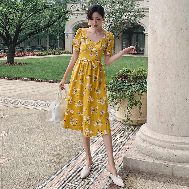 

YIGELILA Women Print Dress Summer V-neck Short Sleeve Empire Slim Mid-calf A-line Yellow Casual Dress 64938