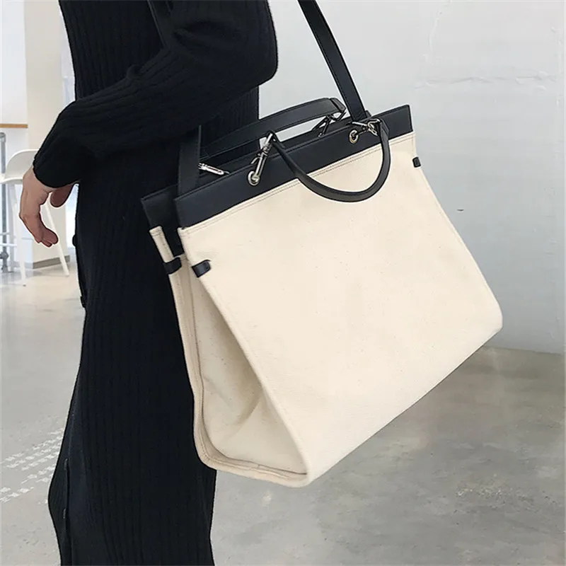 Niche Design Sleek Minimalist Black and White Contrast Color Large Capacity Diagonal Shoulder Canvas Bag Women Purse and Handbag
Niche Design Sleek Minimalist Black and White Contrast Color Large Capacity Diagonal Shoulder Canvas Bag Women Purse and Handbag