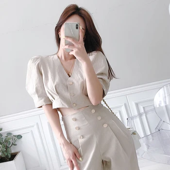 Han edition style v-neck hubble-bubble sleeve blouse of tall waist double-breasted wide-legged pants show thin suit
Han edition style v-neck hubble-bubble sleeve blouse of tall waist double-breasted wide-legged pants show thin suit