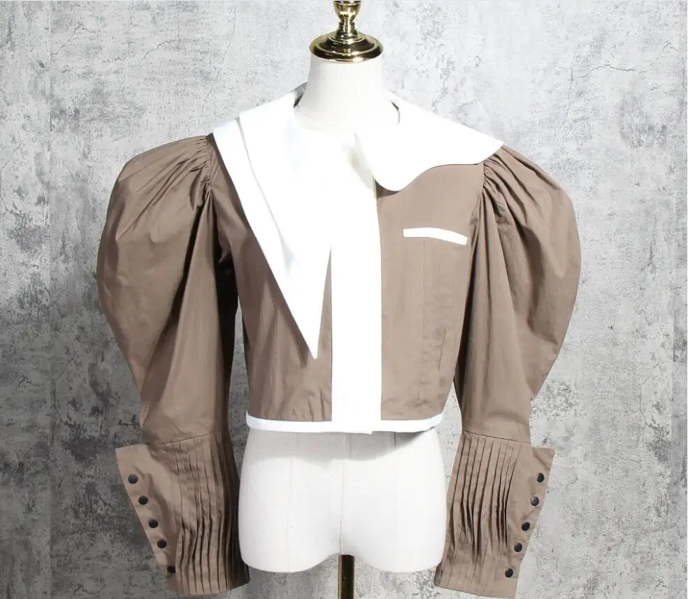 2019 fashion retro handsome British college irregular round collar lantern button sleeve pure color lady elegant shirt
2019 fashion retro handsome British college irregular round collar lantern button sleeve pure color lady elegant shirt