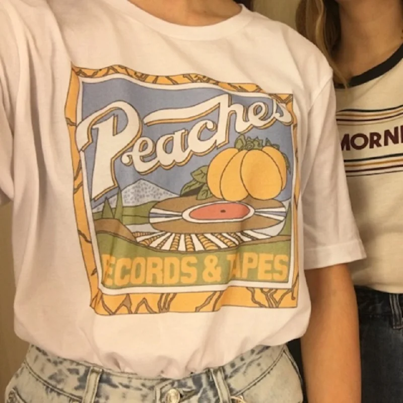 2022 New Street Style Kawaii Cute Unisex Vintage Fashion Peaches Records Tapes Women T-Shirt Hipsters Grunge Style Graphic Tee
2022 New Street Style Kawaii Cute Unisex Vintage Fashion Peaches Records Tapes Women T-Shirt Hipsters Grunge Style Graphic Tee