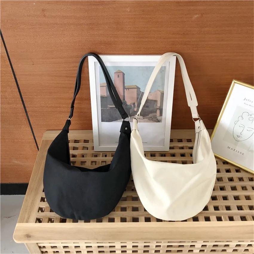 Underarm Dumpling Bag Messenger Canvas Bag Large-capacity Student Vitality Leisure Art and Chic Style All-match White Black
Underarm Dumpling Bag Messenger Canvas Bag Large-capacity Student Vitality Leisure Art and Chic Style All-match White Black