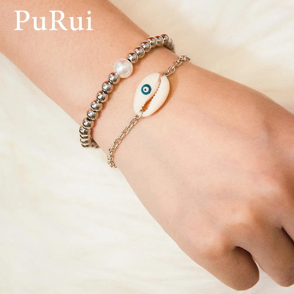PuRui 2Pcs Evil Eye Bracelet Women Shell Charm Bracelets Silver Color Stretch Beads Bracelet Bangles Boho Fashion Summer Jewelry
PuRui 2Pcs Evil Eye Bracelet Women Shell Charm Bracelets Silver Color Stretch Beads Bracelet Bangles Boho Fashion Summer Jewelry