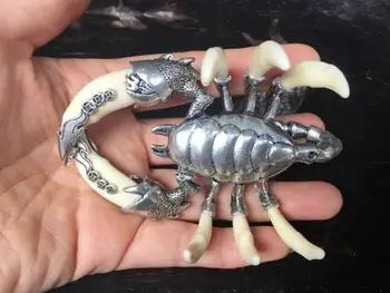 Tibetan silver inlaid wolf tooth Scorpion modeling Decorative statues 
Tibetan silver inlaid wolf tooth Scorpion modeling Decorative statues