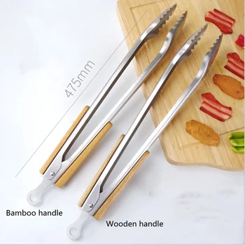 1Pc Stainless Steel BBQ Tongs Kitchen Heat Resistant Wood Handle Larger Tong Kitchen Outdoor Tools BBQ Clips Barbecue Clip Clamp 
1Pc Stainless Steel BBQ Tongs Kitchen Heat Resistant Wood Handle Larger Tong Kitchen Outdoor Tools BBQ Clips Barbecue Clip Clamp