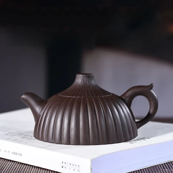Yixing pot of 200 ml hand manual recommended purple clay reinforcement sac recommended
Yixing pot of 200 ml hand manual recommended purple clay reinforcement sac recommended