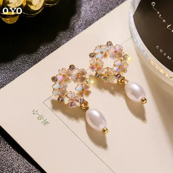 New style temperament shell flower pearl Japanese and Korean high sense French net red earrings
New style temperament shell flower pearl Japanese and Korean high sense French net red earrings