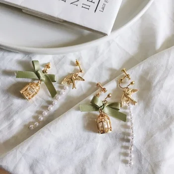 Trend Personality Korean Jewelry Fashion Asymmetric Bow Bird Cage Clip Earrings Women Girl's Imitation Pearl Tassel Accessories 
Trend Personality Korean Jewelry Fashion Asymmetric Bow Bird Cage Clip Earrings Women Girl's Imitation Pearl Tassel Accessories