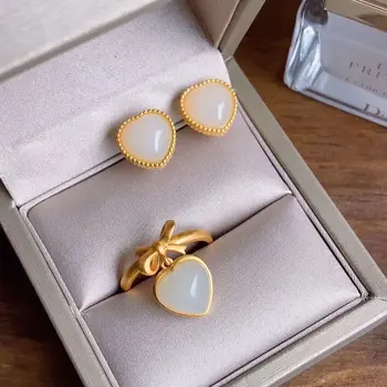 New silver inlaid natural Hetian white Chalcedony love Bow Ring unique ancient gold craft women's mouth adjustable brand jewelry 
New silver inlaid natural Hetian white Chalcedony love Bow Ring unique ancient gold craft women's mouth adjustable brand jewelry