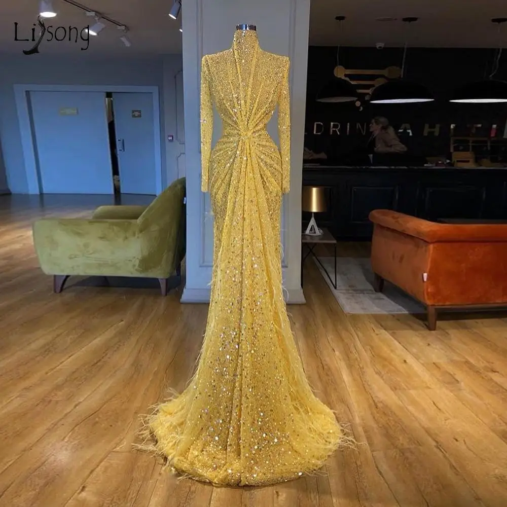 Dubai Luxury Yellow Sequin Beaded Mermaid Prom Dresses High Collar Full Sleeves Long Feather Prom Gowns Sparkle Formal Dress 
Dubai Luxury Yellow Sequin Beaded Mermaid Prom Dresses High Collar Full Sleeves Long Feather Prom Gowns Sparkle Formal Dress
