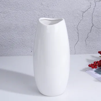 White solid color simple modern Nordic style ceramic vase decoration household flower bed decoration modern ceramics
White solid color simple modern Nordic style ceramic vase decoration household flower bed decoration modern ceramics
