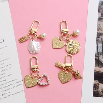 2020 Cute Creative Shell Imitated Pearl Gold Color Keychain For Women Key Chains Ring Car Bag Pendent AirPods Accessories D399
2020 Cute Creative Shell Imitated Pearl Gold Color Keychain For Women Key Chains Ring Car Bag Pendent AirPods Accessories D399