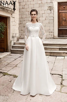 NAAY 2020 Elegant Wedding Dresses Long Sleeves Lace Appliques Wedding Gowns Vintage Bride Dress Plus Size Vestido De Novia 
NAAY 2020 Elegant Wedding Dresses Long Sleeves Lace Appliques Wedding Gowns Vintage Bride Dress Plus Size Vestido De Novia