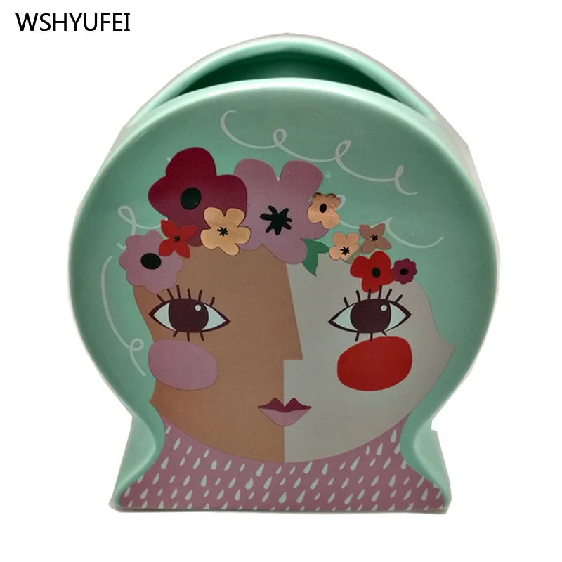 Best selling Chinese style drum type waitress face ceramic vase home flower inserted living room floral decoration ornaments
Best selling Chinese style drum type waitress face ceramic vase home flower inserted living room floral decoration ornaments
