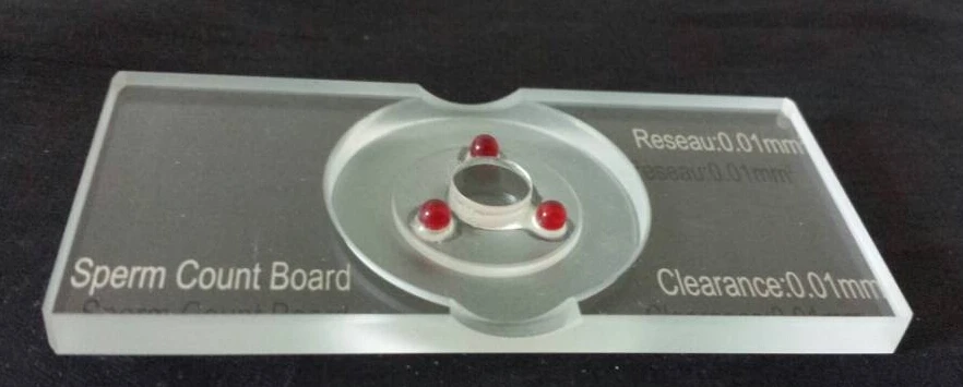 

sperm counting chamber with grid Hemocytometer Blood count board with red ruby for lab study