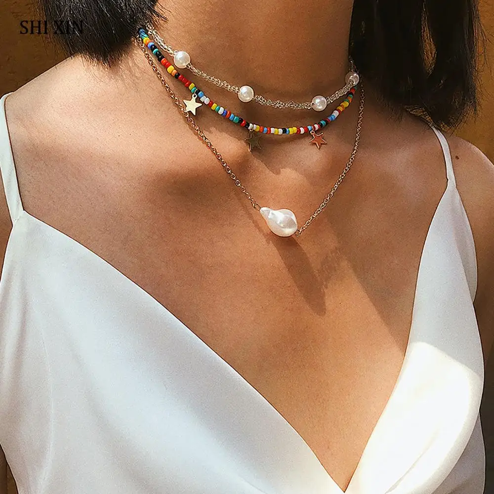 SHIXIN Boho Rainbow Small Beads Necklace Fashion Star/Pearl Pendant Necklace for Women Layered Colorful Beaded Chain on the Neck
SHIXIN Boho Rainbow Small Beads Necklace Fashion Star/Pearl Pendant Necklace for Women Layered Colorful Beaded Chain on the Neck