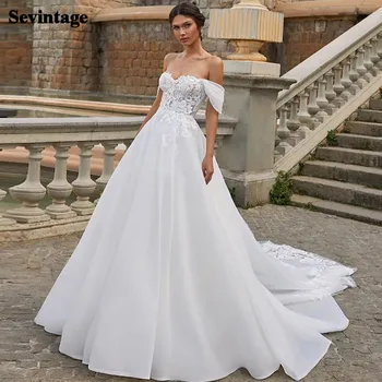 Sevintage Off Shoulder Boho Wedding Dresses Lace Appliques Princess Beach Bride Dress Organza Open Back Bridal Gown Long Tail
Sevintage Off Shoulder Boho Wedding Dresses Lace Appliques Princess Beach Bride Dress Organza Open Back Bridal Gown Long Tail