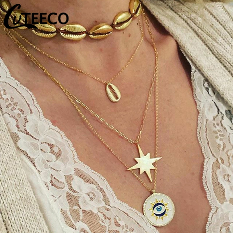 Cuteeco Bohemia Gold Shell Star Moon Eye Pendant Multilayer Clavicle Chain Bohemian Charm Women Jewelry Accessories Gift
Cuteeco Bohemia Gold Shell Star Moon Eye Pendant Multilayer Clavicle Chain Bohemian Charm Women Jewelry Accessories Gift