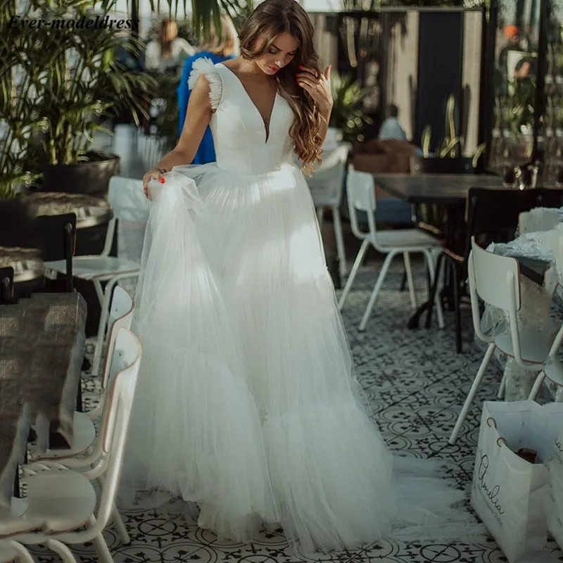 Boho wedding Dresses 2020 Deep V-Neck Cap Sleeves Backless A-Line Country Beach Simple Bridal Gowns Vestido De Novia
Boho wedding Dresses 2020 Deep V-Neck Cap Sleeves Backless A-Line Country Beach Simple Bridal Gowns Vestido De Novia