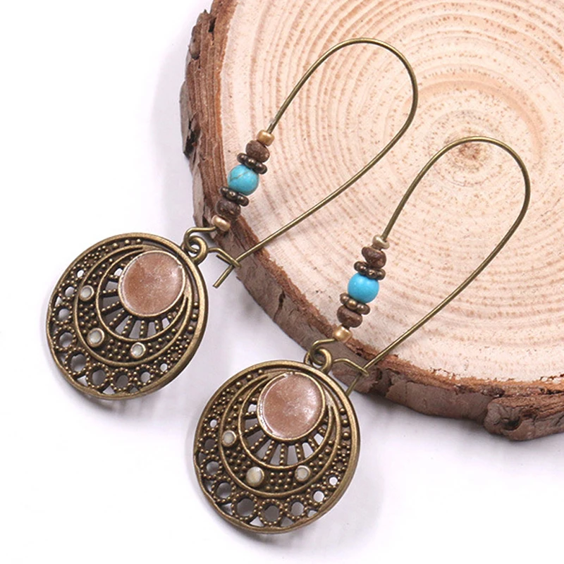 Vintage Beads Hollow Round Pendant Hoop Earrings for Women Girl Ethnic Bohemia Bronze Totem Drop Ear Cuff Earrings Hoop Jewelry
Vintage Beads Hollow Round Pendant Hoop Earrings for Women Girl Ethnic Bohemia Bronze Totem Drop Ear Cuff Earrings Hoop Jewelry
