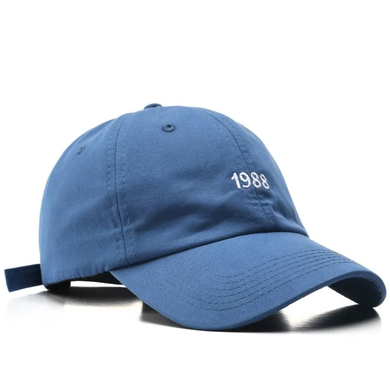 Unisex cotton cap alongside men's fashion items including jackets, suits, shorts, shoes, oversized watches, and hoodies in a streetwear style0