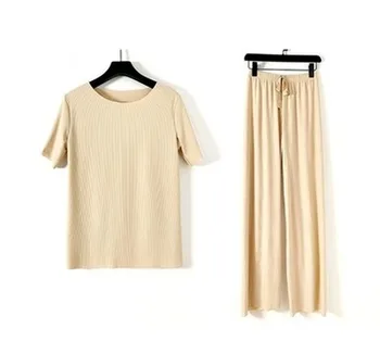Summer thin Knitting Suit Women Short Sleeve Top Long Wide Leg Pants Two Piece Set 
Summer thin Knitting Suit Women Short Sleeve Top Long Wide Leg Pants Two Piece Set