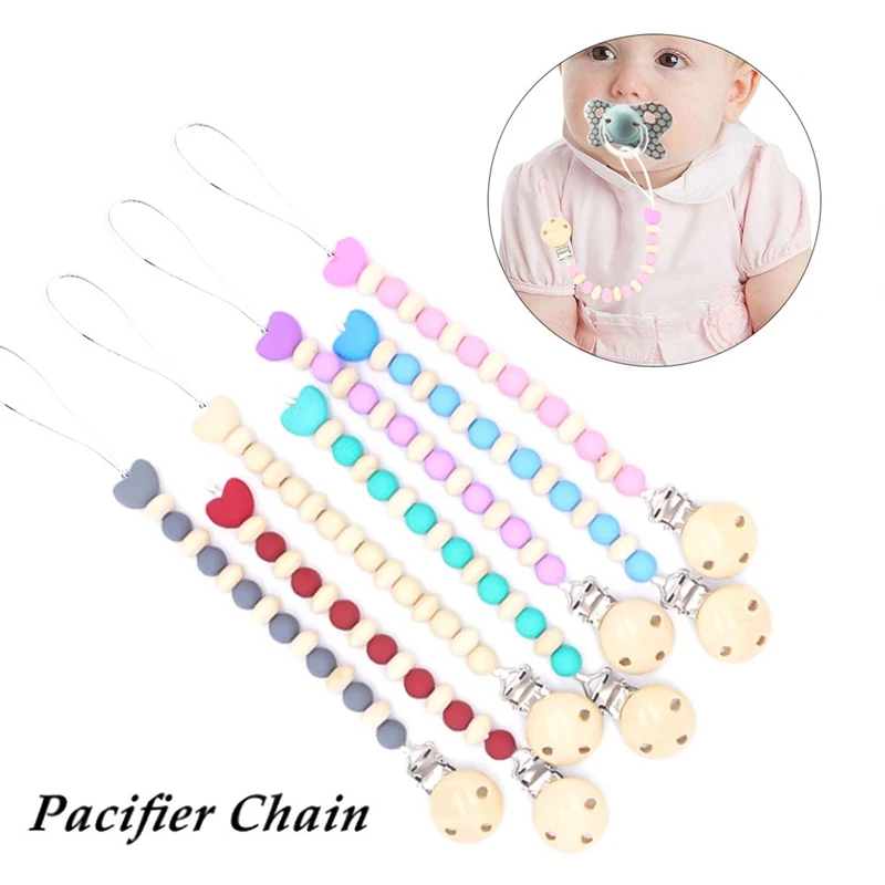 Wood Pacifier Clip Wooden Bead Dummy Clip Holder Cute Pacifier Clips Soother Chains Baby Teething Toy for Baby Chew
Wood Pacifier Clip Wooden Bead Dummy Clip Holder Cute Pacifier Clips Soother Chains Baby Teething Toy for Baby Chew