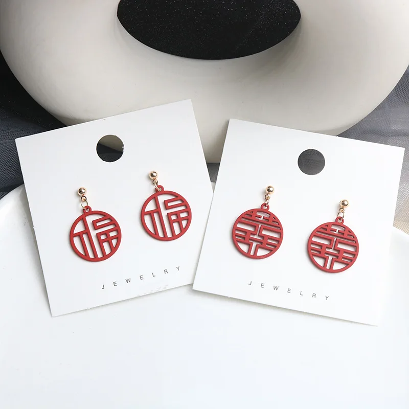 Chinese style earring with hollow text double happiness antique style eardrop girl
Chinese style earring with hollow text double happiness antique style eardrop girl