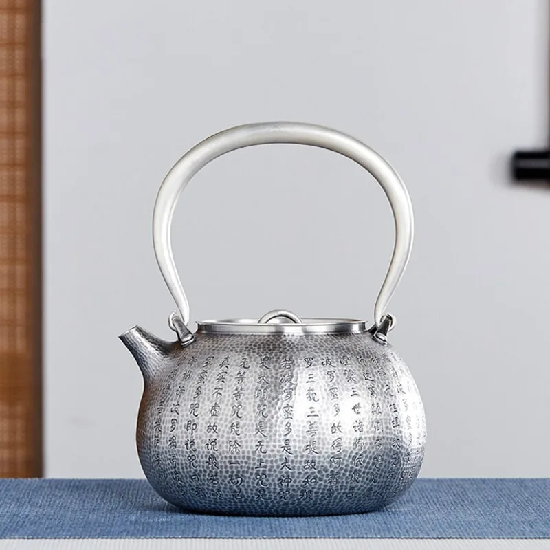Large-capacity 999 silver kettle, handmade teapot, Kung Fu tea set, heart sutra silver kettle, high-end gifts 1100ml, 694g
Large-capacity 999 silver kettle, handmade teapot, Kung Fu tea set, heart sutra silver kettle, high-end gifts 1100ml, 694g