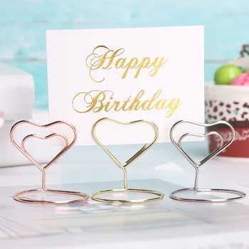 1PC Metal Card Holder Wedding Party Desktop Decoration Romantic Heart Ring Shape Photo Clip Table Number Stand Memo Pincer
1PC Metal Card Holder Wedding Party Desktop Decoration Romantic Heart Ring Shape Photo Clip Table Number Stand Memo Pincer