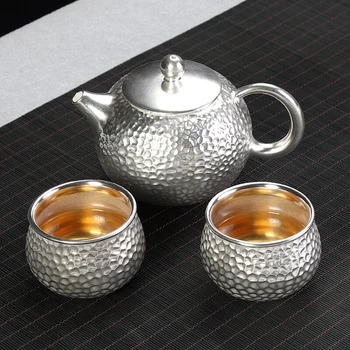 S999 sterling silver tea cup, one teapot and two cups, ceramic Kung Fu tea, portable office travel tea set (for 2 people) 
S999 sterling silver tea cup, one teapot and two cups, ceramic Kung Fu tea, portable office travel tea set (for 2 people)