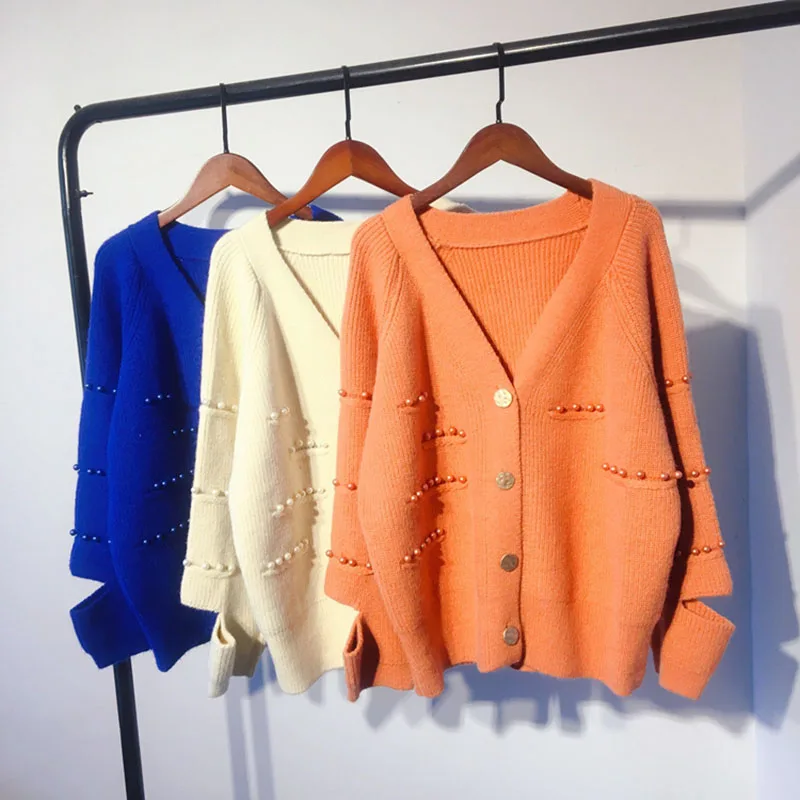 2019 Autumn Female Chic Sweater Long Sleeve Solid Split Hole Cardigans Pearl Loose V-Neck OL Casual Streetwear Knitted Clothes
2019 Autumn Female Chic Sweater Long Sleeve Solid Split Hole Cardigans Pearl Loose V-Neck OL Casual Streetwear Knitted Clothes