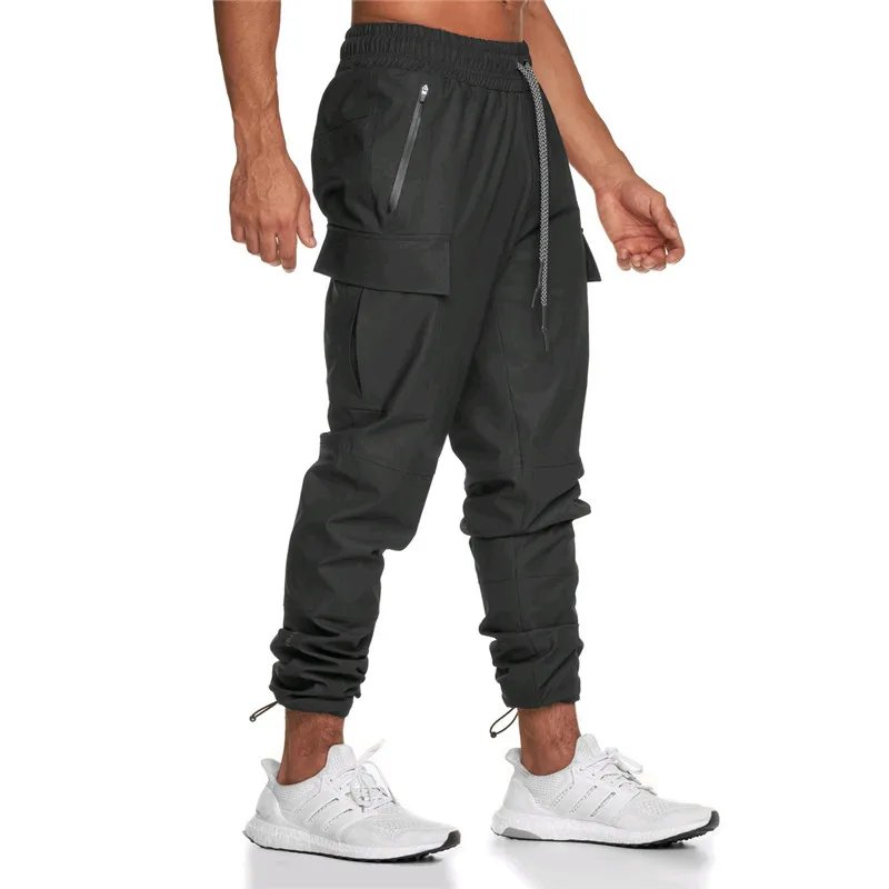 Winter 2020 outdoor Multi Pocket sports pants men's running training fitness pants waterproof technology closed leg pants 
Winter 2020 outdoor Multi Pocket sports pants men's running training fitness pants waterproof technology closed leg pants