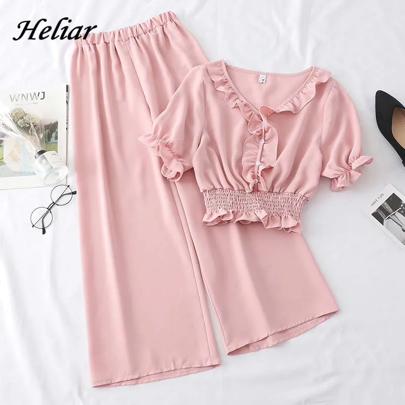 Heliar 2019 Summer Buttons Ruffles Top and Elastic Waisted Trousers Two piece Outfits Women Sets two piece set Top and Trousers
Heliar 2019 Summer Buttons Ruffles Top and Elastic Waisted Trousers Two piece Outfits Women Sets two piece set Top and Trousers