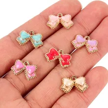 Encantador Doce 10 pçs/lote Rosa/Branco/Preto Esmalte Liga Bow Pingente Encanto Para As Mulheres Meninas Brincos Jóias DIY achados Fazer(China)