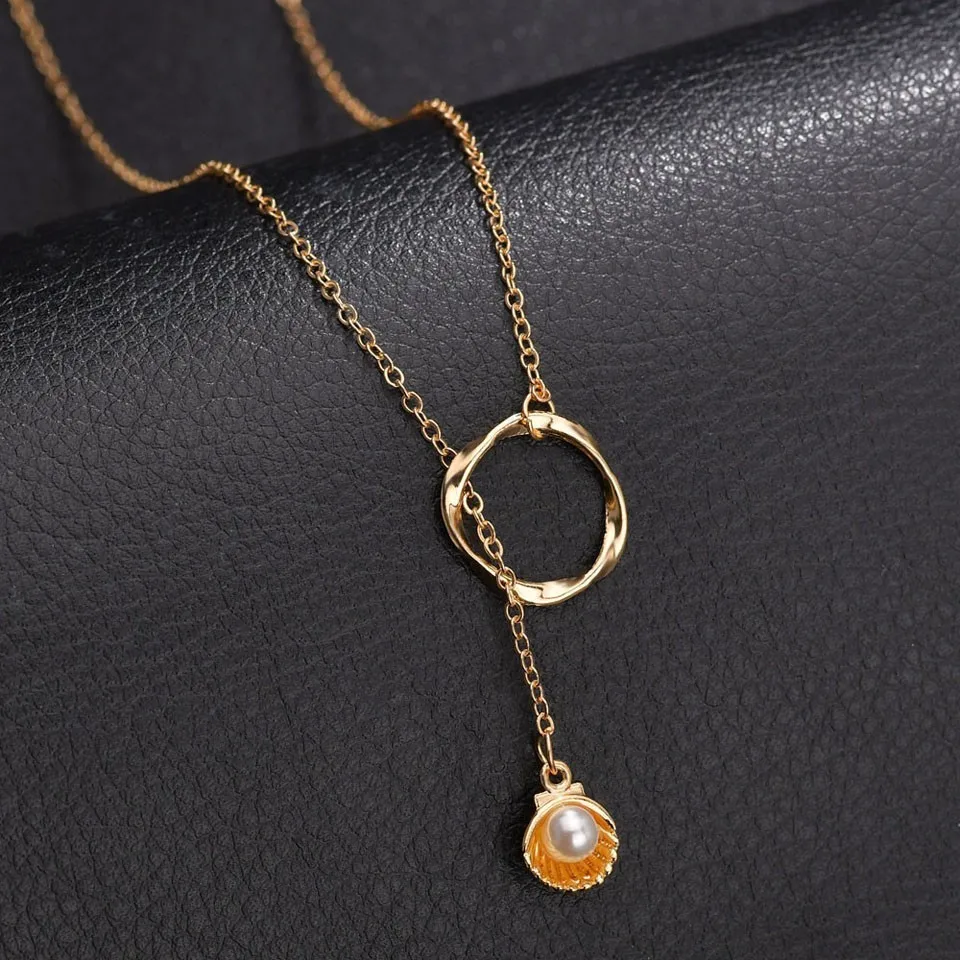 Women Trendy Gold Shell With Pearl Pendant Necklace Through Circle Handmede Hallow Round Necklace Jewelry Female Wedding Jewelry
Women Trendy Gold Shell With Pearl Pendant Necklace Through Circle Handmede Hallow Round Necklace Jewelry Female Wedding Jewelry
