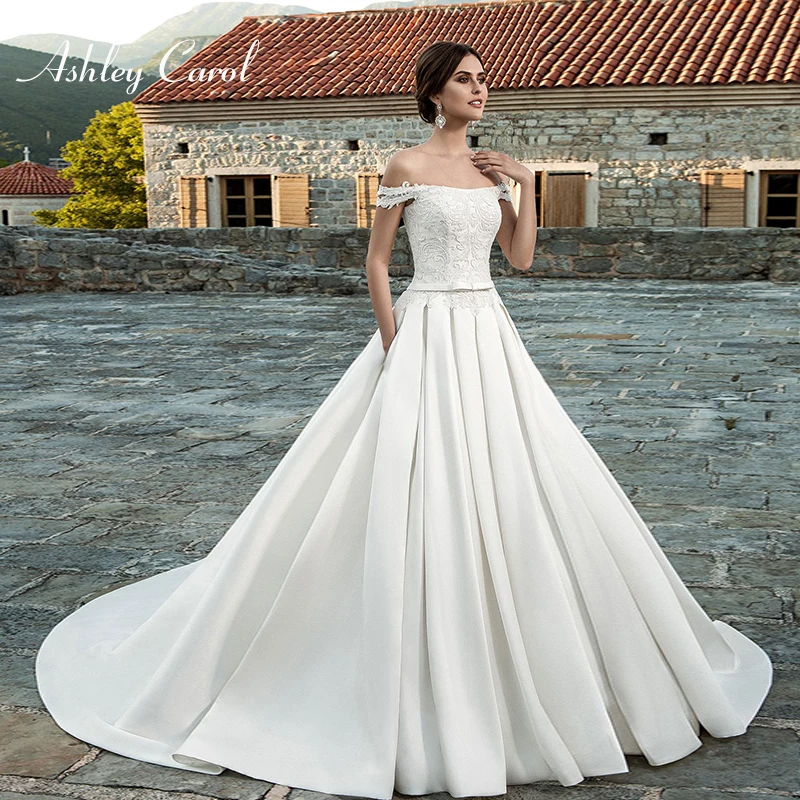 Ashley Carol Satin Luxury A-Line Wedding Dress 2019 Boat Neck Off the Shoulder Court Train Vintage Bride Gown Vestido de Noiva
Ashley Carol Satin Luxury A-Line Wedding Dress 2019 Boat Neck Off the Shoulder Court Train Vintage Bride Gown Vestido de Noiva