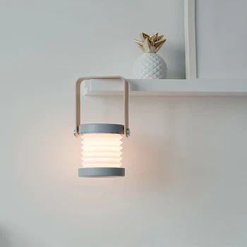 Creative wooden handle portable lantern lamp telescopic folding led table lamp charging night light reading lamp
Creative wooden handle portable lantern lamp telescopic folding led table lamp charging night light reading lamp