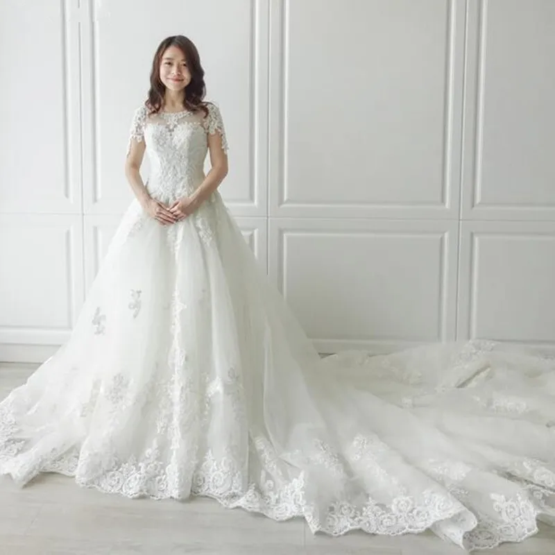 Sexy O-neck cathedral Train Long Zipper Cap Sleeves Beading pearl Lace A Line Beach Wedding Dress Real Photo Wedding Gown 2019
Sexy O-neck cathedral Train Long Zipper Cap Sleeves Beading pearl Lace A Line Beach Wedding Dress Real Photo Wedding Gown 2019