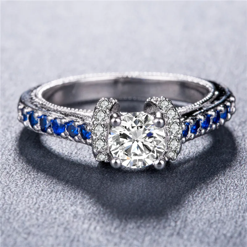 Huitan Statement Ring with Round Brilliant White&Blue Cubic Zirconia Prong Setting Unique Wedding Engagement Rings for Women
Huitan Statement Ring with Round Brilliant White&Blue Cubic Zirconia Prong Setting Unique Wedding Engagement Rings for Women