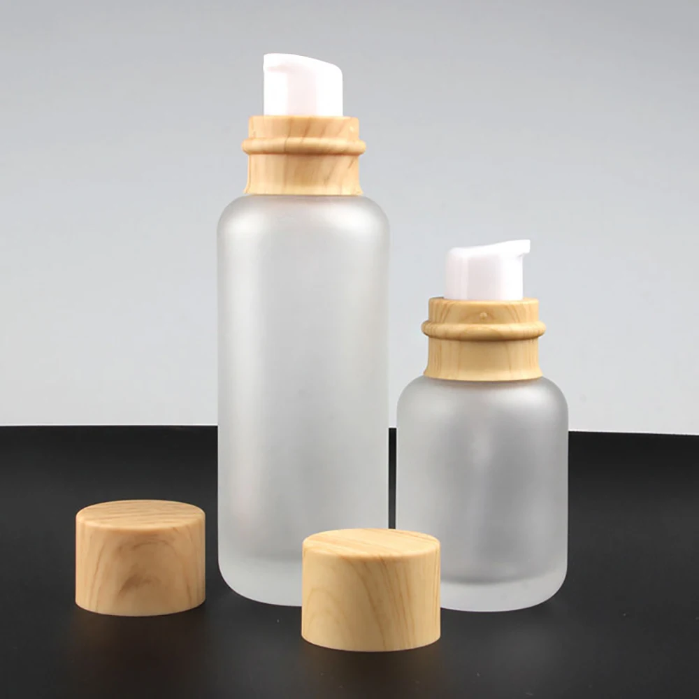Fashion frosted serum bottle 110ml frosted glass jar with wooden lid for cosmetic packaging
Fashion frosted serum bottle 110ml frosted glass jar with wooden lid for cosmetic packaging
