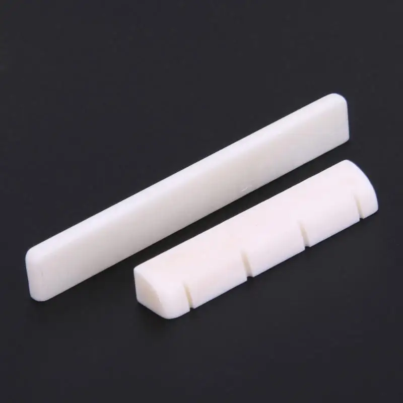 New Guitar Replacement Beige Buffalo Ukulele Uke Guitar Stringed Instruments Bone Bridge Saddle Nut Set Slotted Accessories
New Guitar Replacement Beige Buffalo Ukulele Uke Guitar Stringed Instruments Bone Bridge Saddle Nut Set Slotted Accessories