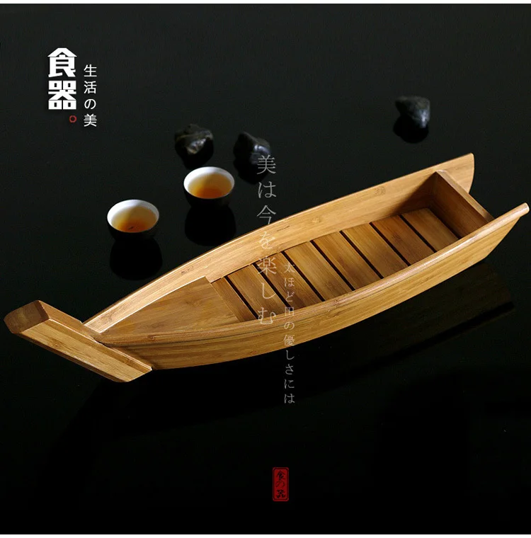 

Japanese sushi bamboo boat artistic conception salmon lobster dry ice long cooking boat dish seafood and radish raw fish plate