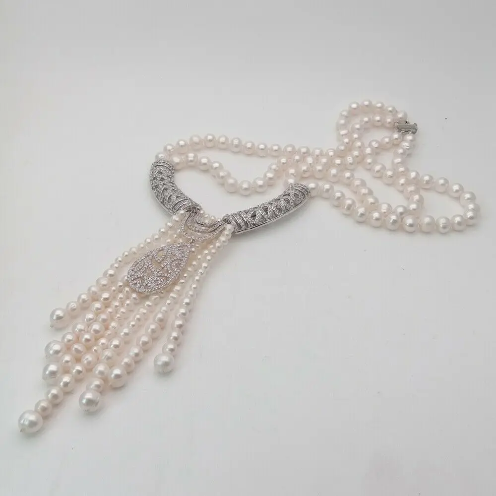 Hand knotted natural 8-9mm white freshwater pearl necklace zircon pendant tassel personality fashion
Hand knotted natural 8-9mm white freshwater pearl necklace zircon pendant tassel personality fashion