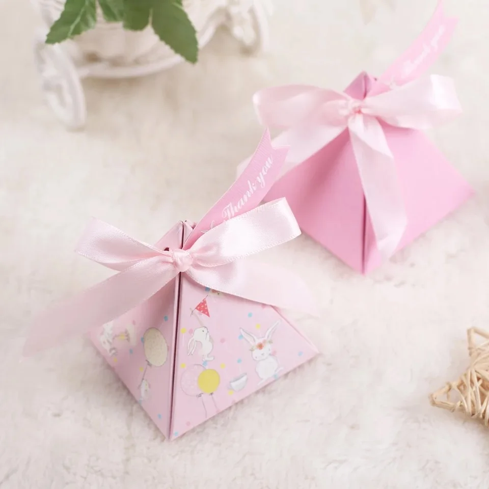 100pcs New pink Triangular Pyramid cartoon rabbit Candy Boxes + thank you tags Bomboniere birthday Party Wedding Favors Gift Box
100pcs New pink Triangular Pyramid cartoon rabbit Candy Boxes + thank you tags Bomboniere birthday Party Wedding Favors Gift Box