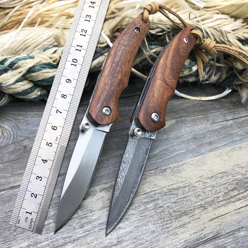 new Damascus Hunting folding knives portable style knife 9Cr14 Steel Wood handle key chain knife EDC tool camping survival knife
new Damascus Hunting folding knives portable style knife 9Cr14 Steel Wood handle key chain knife EDC tool camping survival knife
