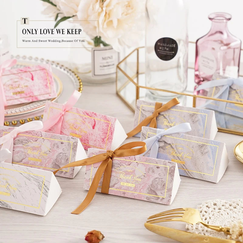 50Pcs/lot Triangular long Paper Candy Box Wedding Gift Boxes Chocolate Box Creative Wedding Favors And Gifts Party Supplies
50Pcs/lot Triangular long Paper Candy Box Wedding Gift Boxes Chocolate Box Creative Wedding Favors And Gifts Party Supplies