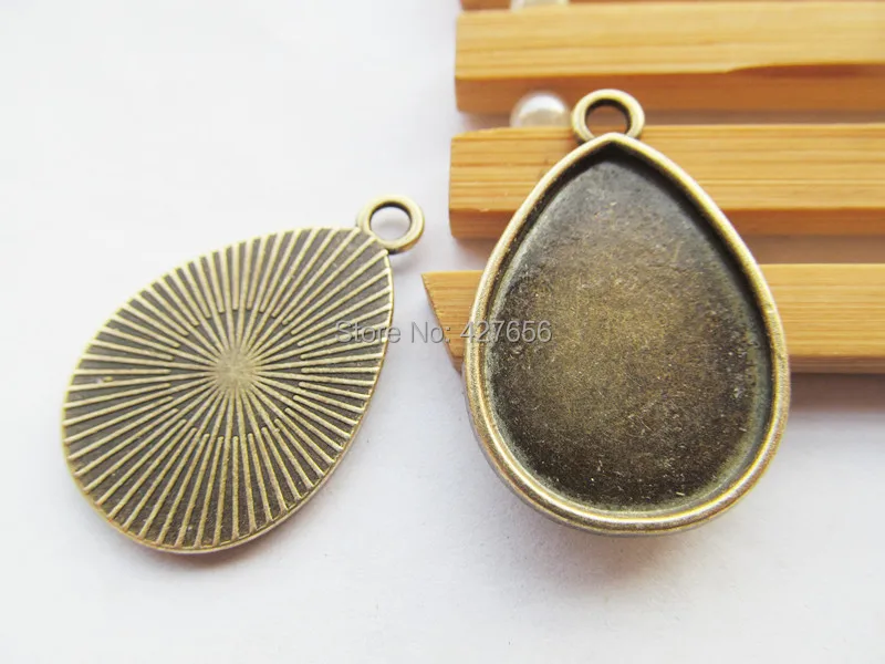100pcs Antique Bronze Raindrop Base Setting Tray Bezel Pendant Charm/Finding,fit 18mmx25mm Cabochon/Picture/Cameo
100pcs Antique Bronze Raindrop Base Setting Tray Bezel Pendant Charm/Finding,fit 18mmx25mm Cabochon/Picture/Cameo